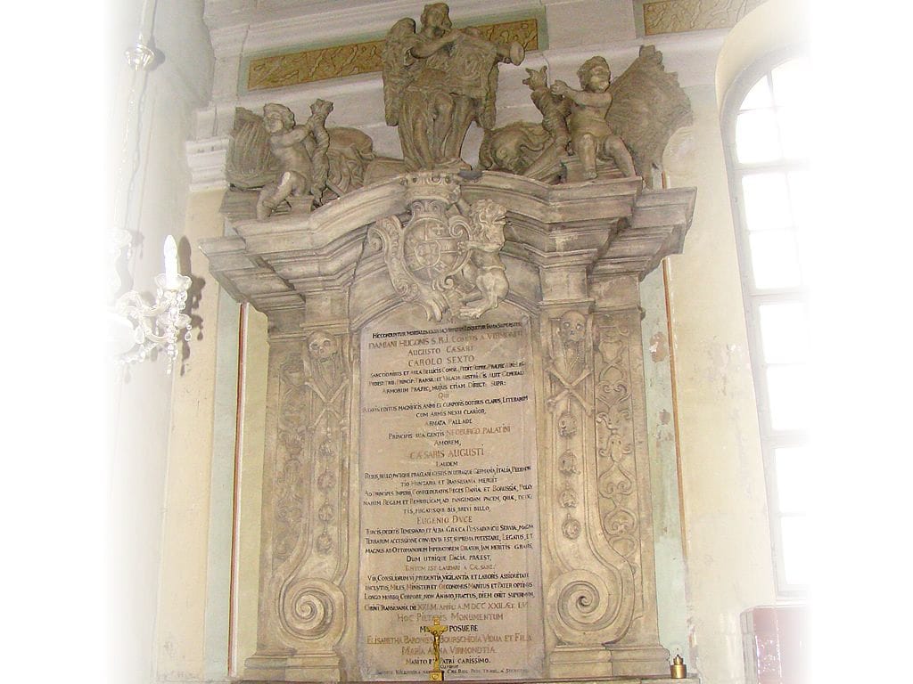 Virmond funerary monument in Sibiu’s Franciscan Church—heraldry, putti, and Latin inscription on a Baroque aedicule.